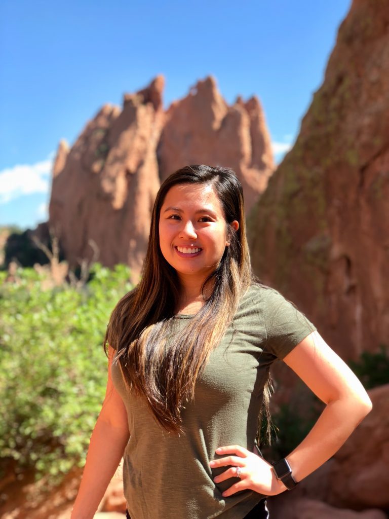 Clarissa Tenido, outside with rocky mountains in the background