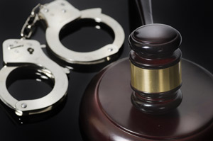 criminal justice - handcuffs and gavel on table
