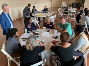 Residents speak at a Synergy Project meeting on Spalding's campus